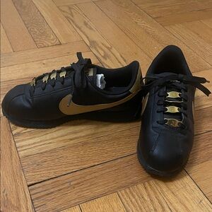 Nike Black and Gold Cortez sneakers